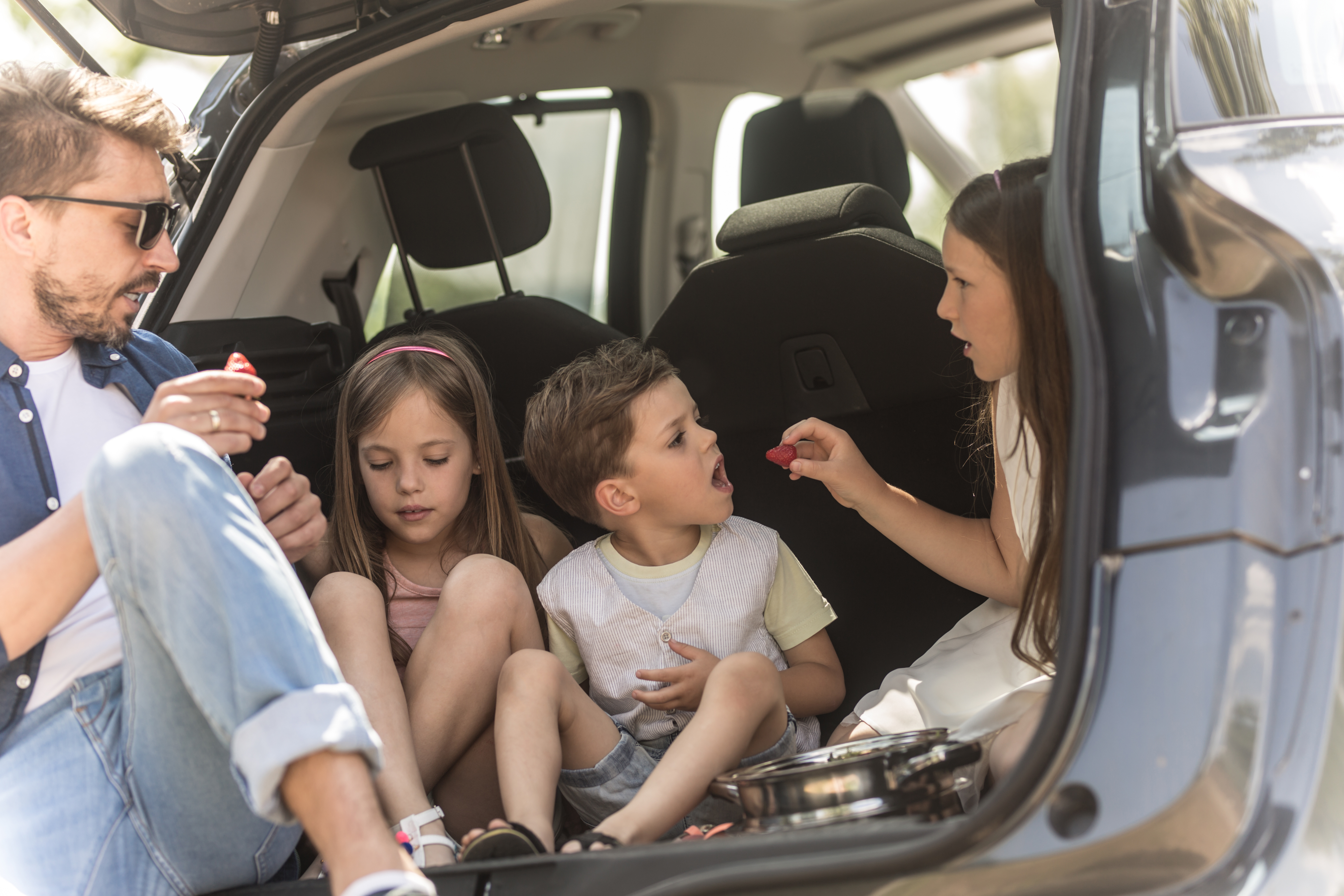 Family vacation traveling by car. 
Source: Canva